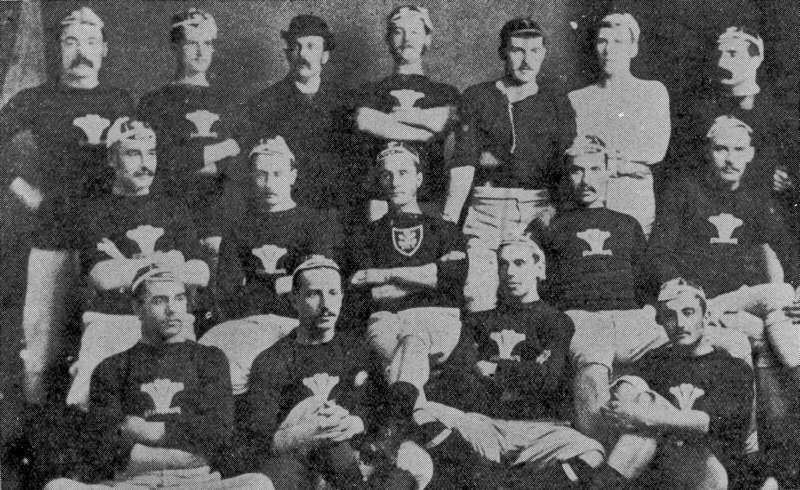 The first Wales rugby union international team, 1881, in dark jerseys bearing the Prince of Wales feathers