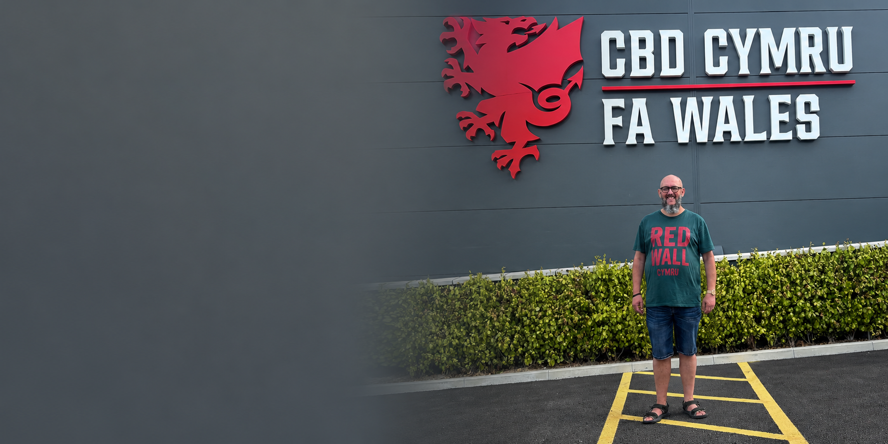 Customer wearing the Made in Cymru Red Wall T-shirt outside FA Wales