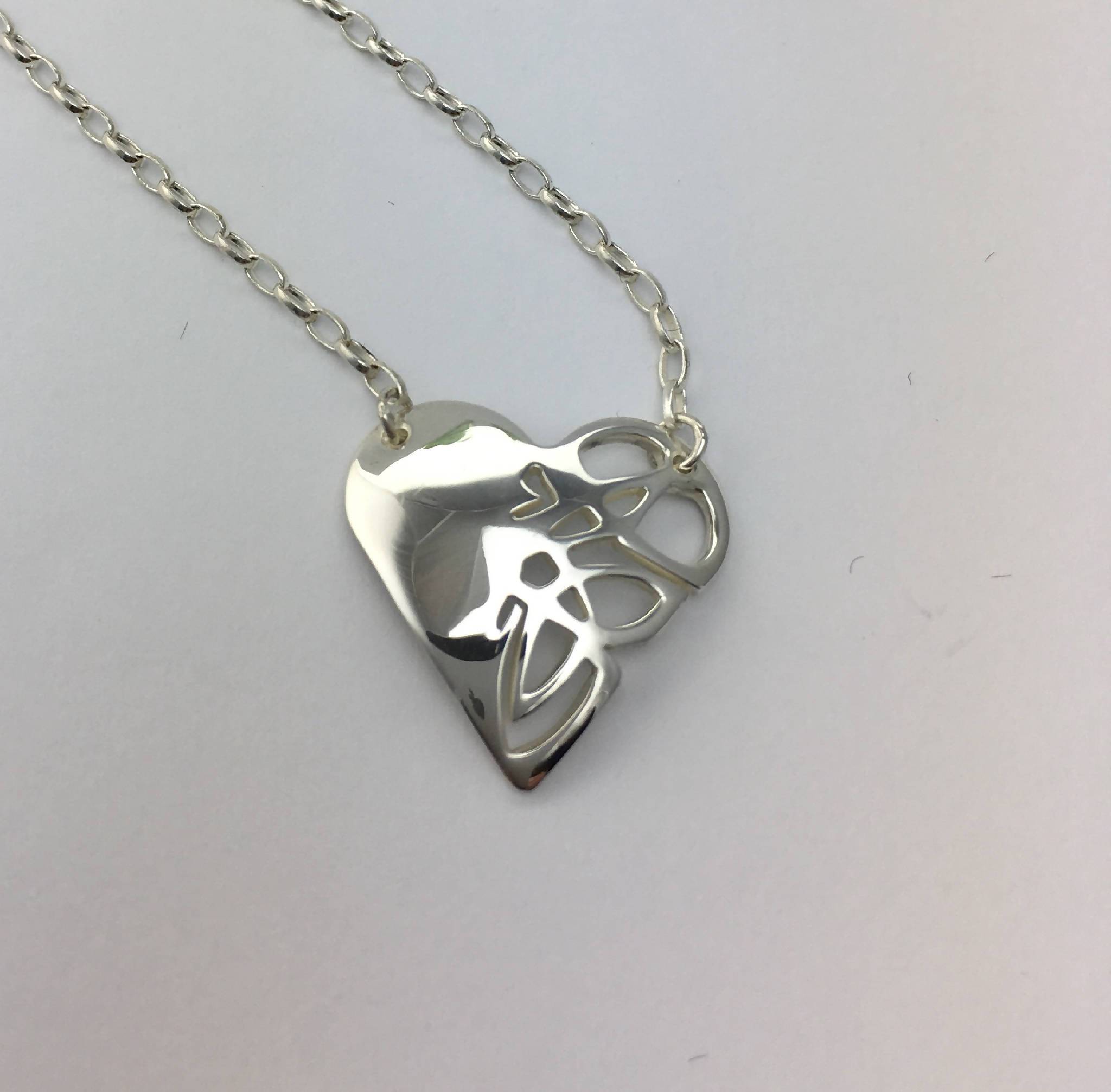 Small heart shaped pendant with Celtic knot design