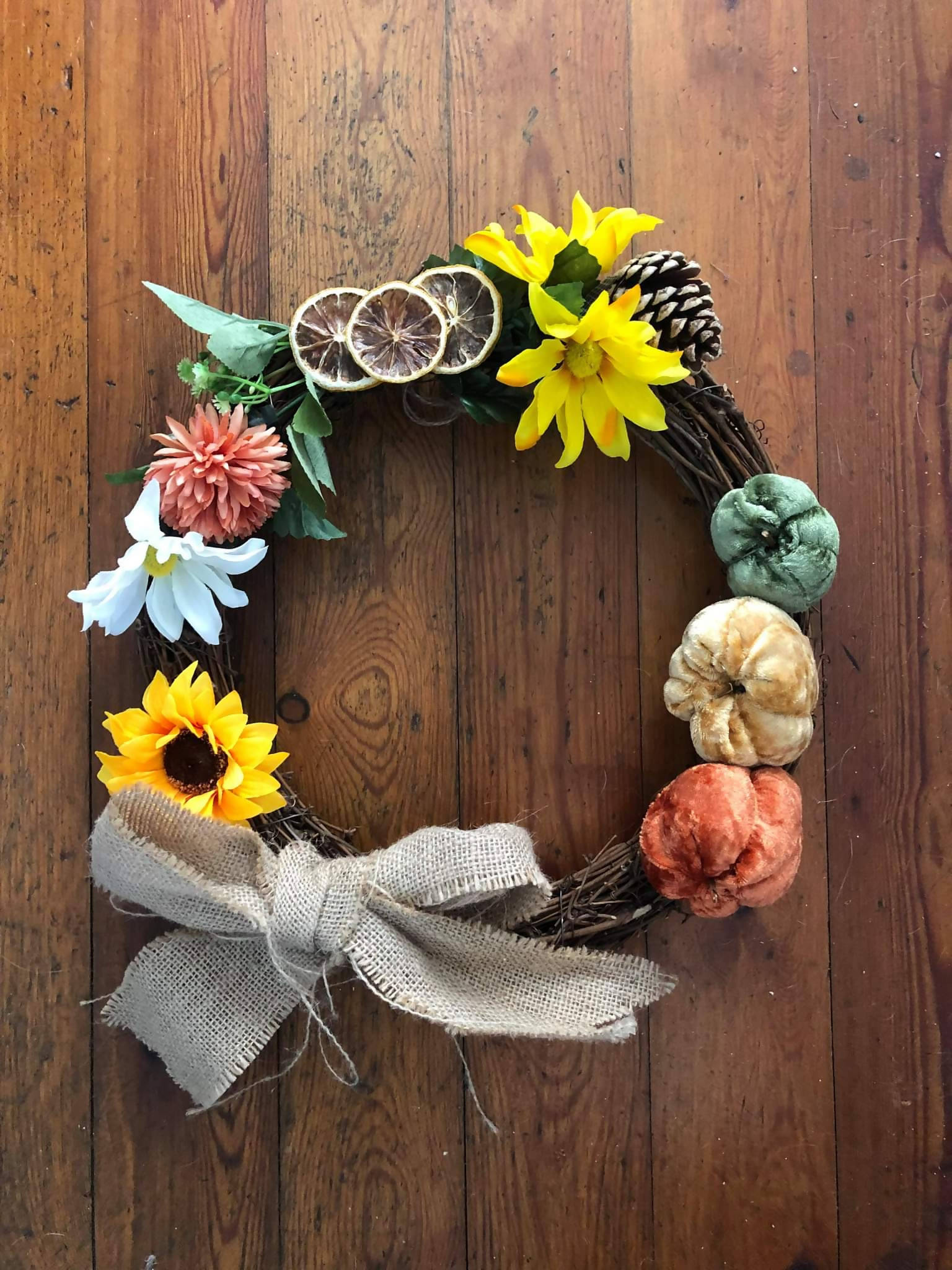 Autumnal wreath with cute pumpkins