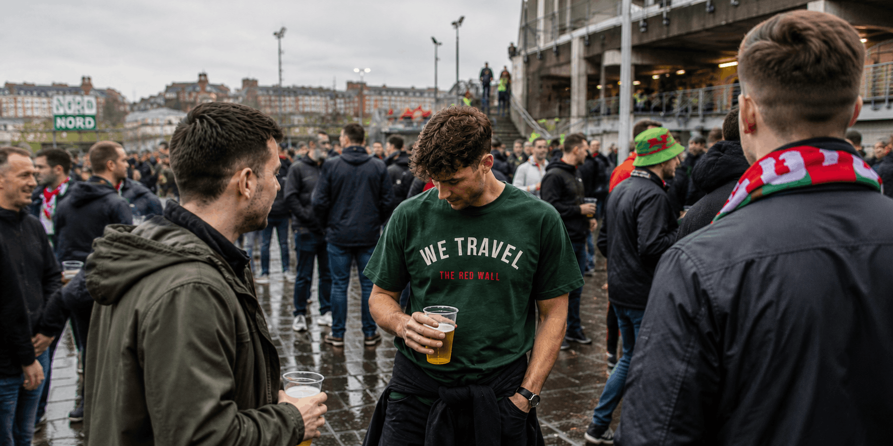 Welsh football supporter wearing the We Travel The Red Wall t-shirt before an away game.