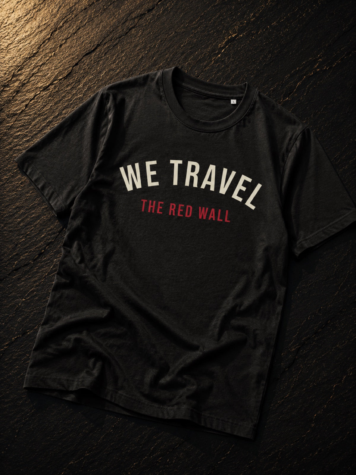 We Travel the Red Wall Welsh football t-shirt in black, Made in Cymru