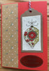 Cross stitch Christmas card with gift tag