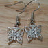 Handmade earrings with silver coloured butterfly charms
