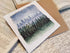 Greetings card of watercolour print of a winter forest