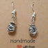 Handmade earrings with antique silver coloured twisted knot bead
