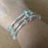 3 strand silver toned memory wire bangle with clear & silver coloured beads, 6.5cm diameter