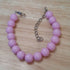 Pink coloured bracelet, handmade using recycled beads,16cm length plus extender chain
