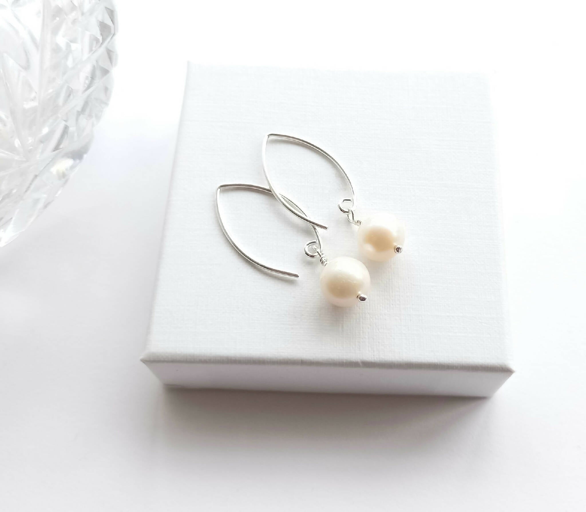 White pearl drop earrings