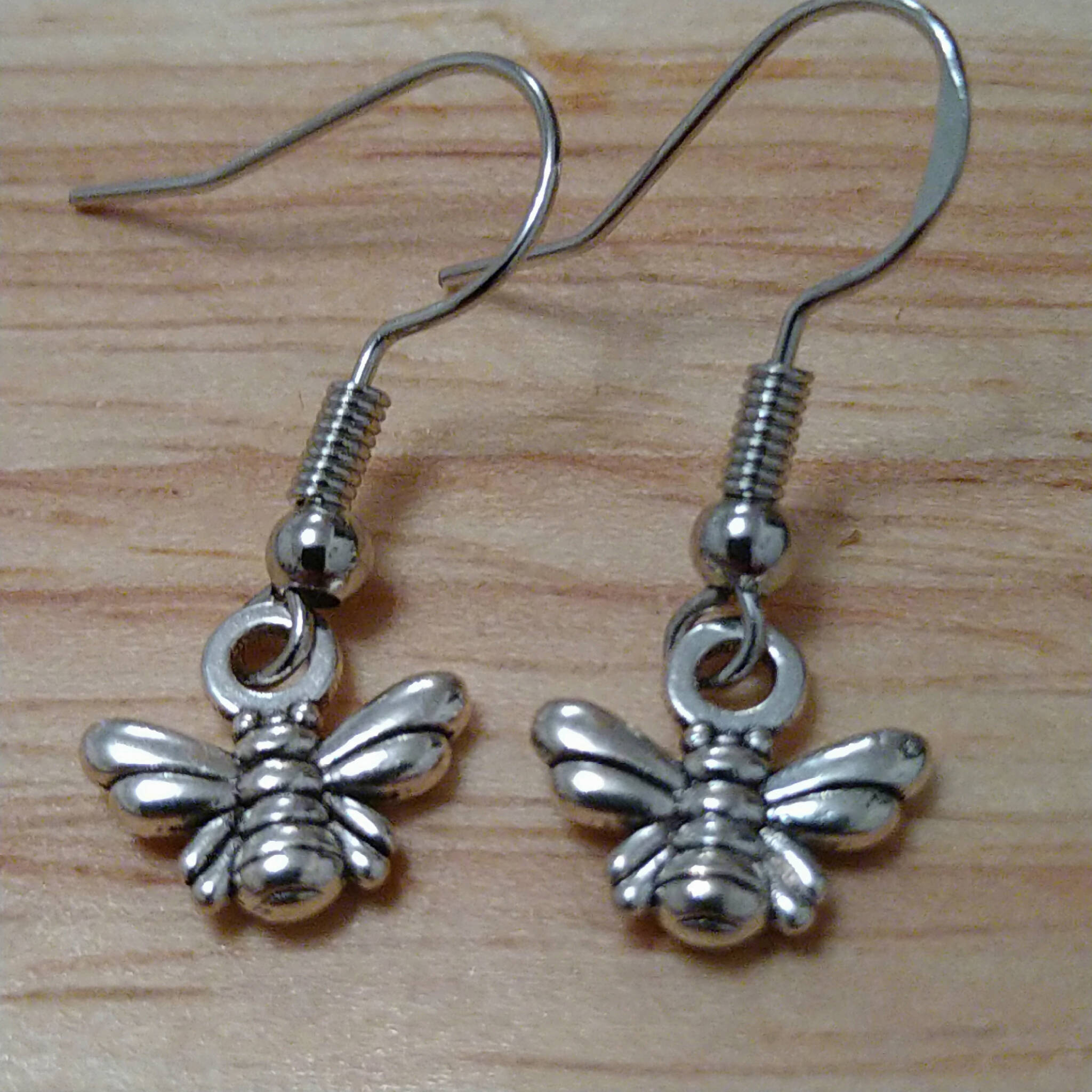 Handmade earrings with silver coloured bee charms