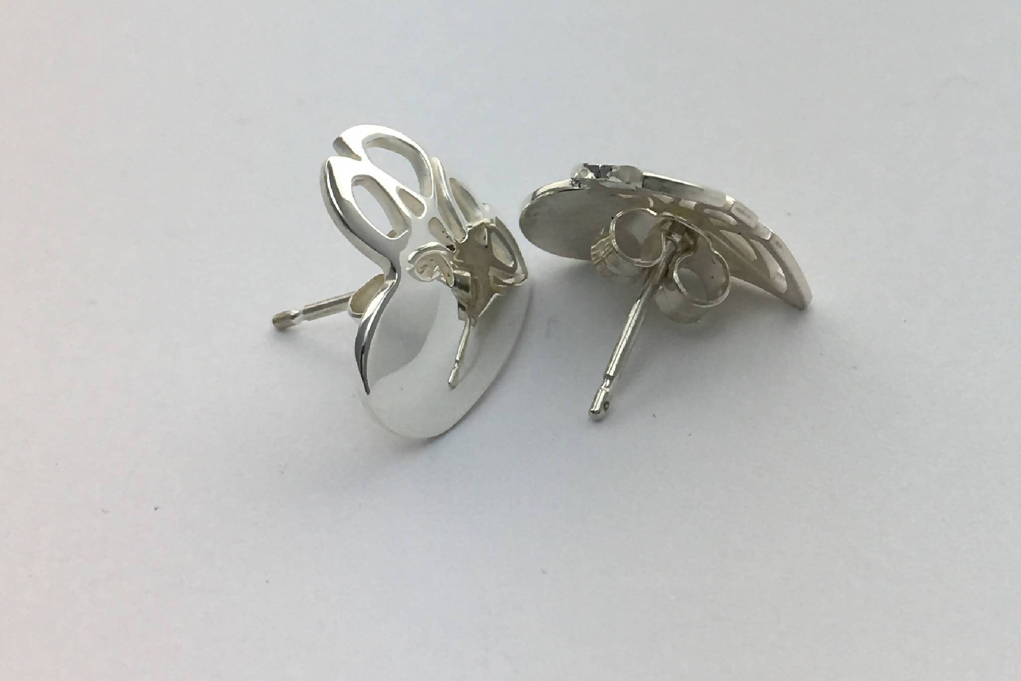 Heart shape stud earrings with Celtic knot design