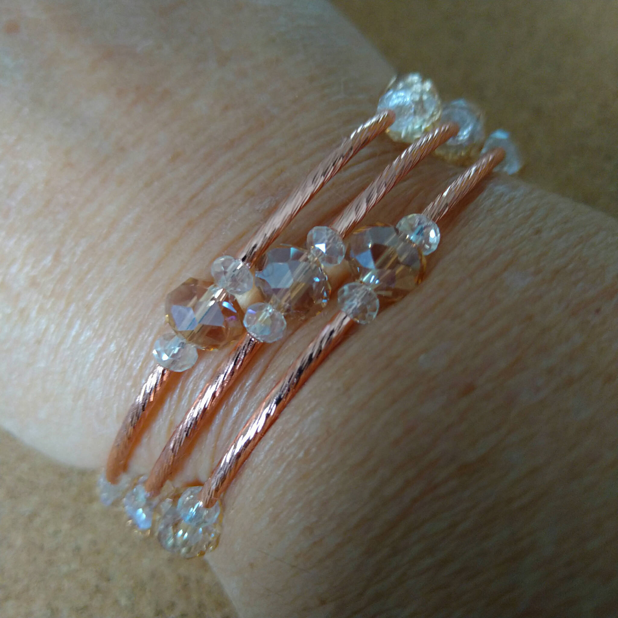 3 strand rose gold toned memory wire bangle with champagne & clear beads, 6cm diameter