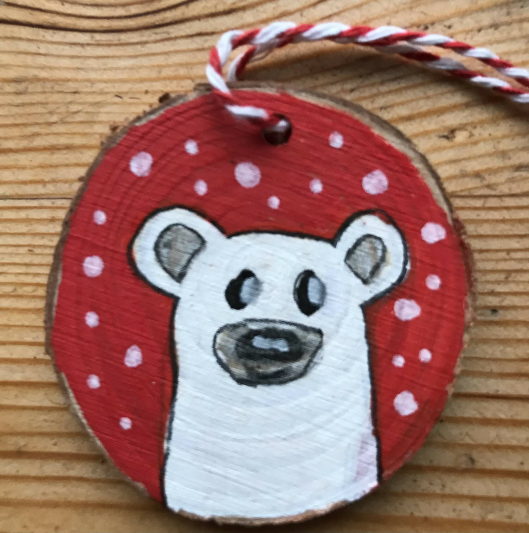 Wood cookie Christmas decorations bear in snow
