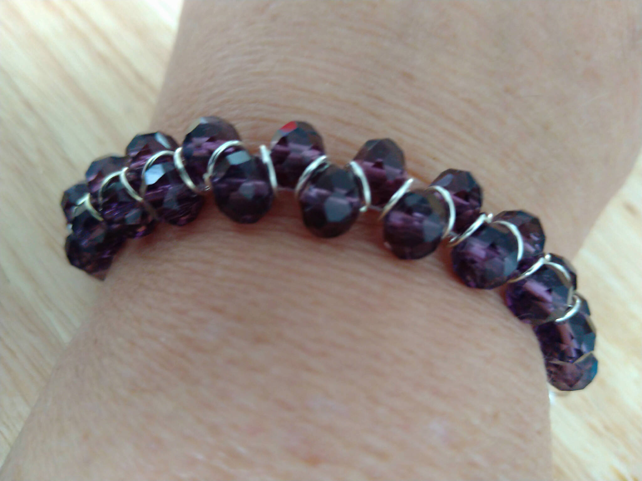 Purple coloured bracelet, handmade using glass faceted beads in a zigzag pattern. 18cm length