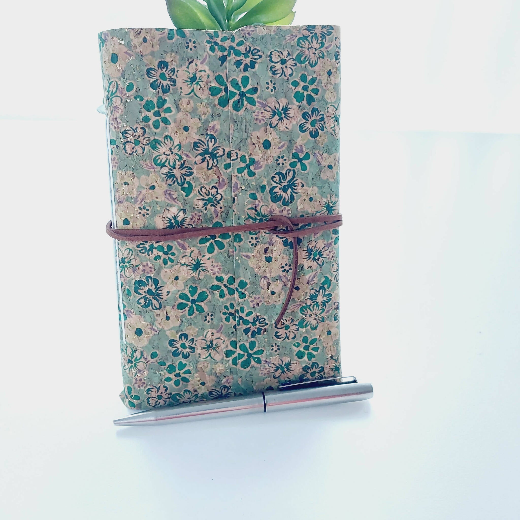 Green Floral Notebook plant, pen