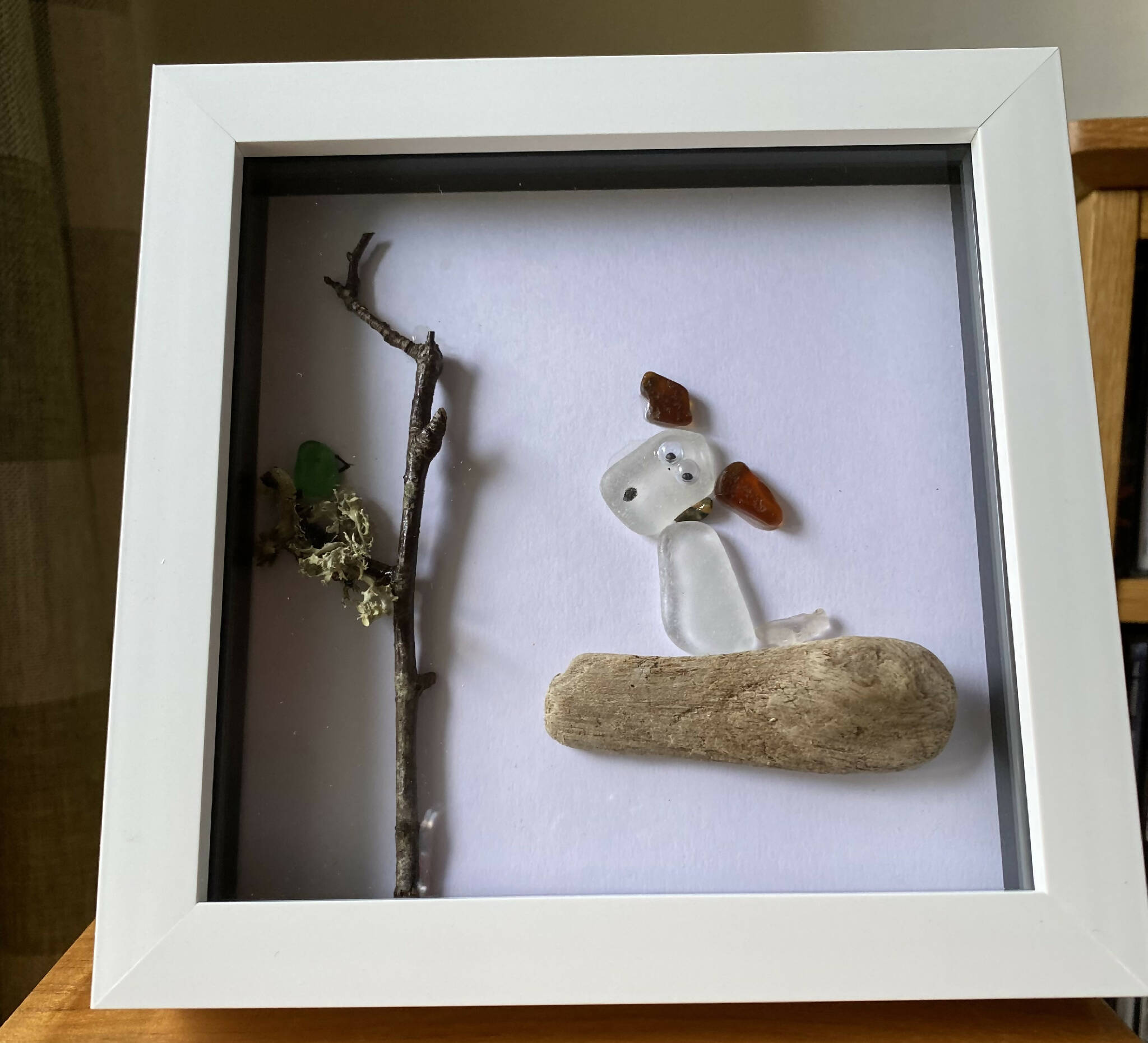 Dog and bird sea glass picture
