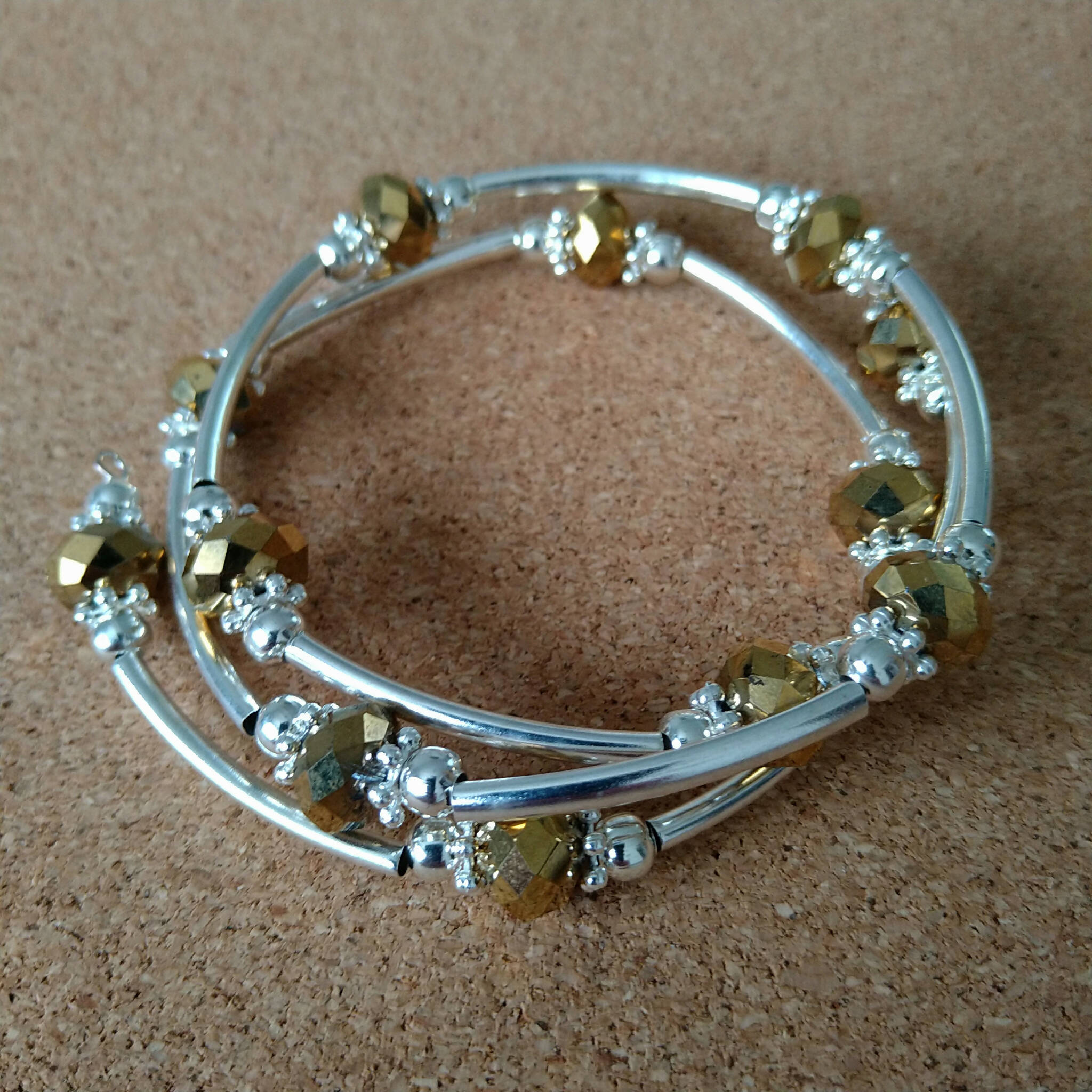 2.5 strand silver toned memory wire bangle with gold & silver coloured beads, 6.5cm diameter