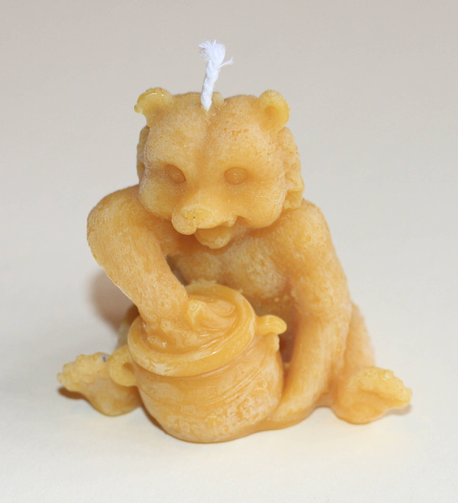 bear with hive beeswax candle
