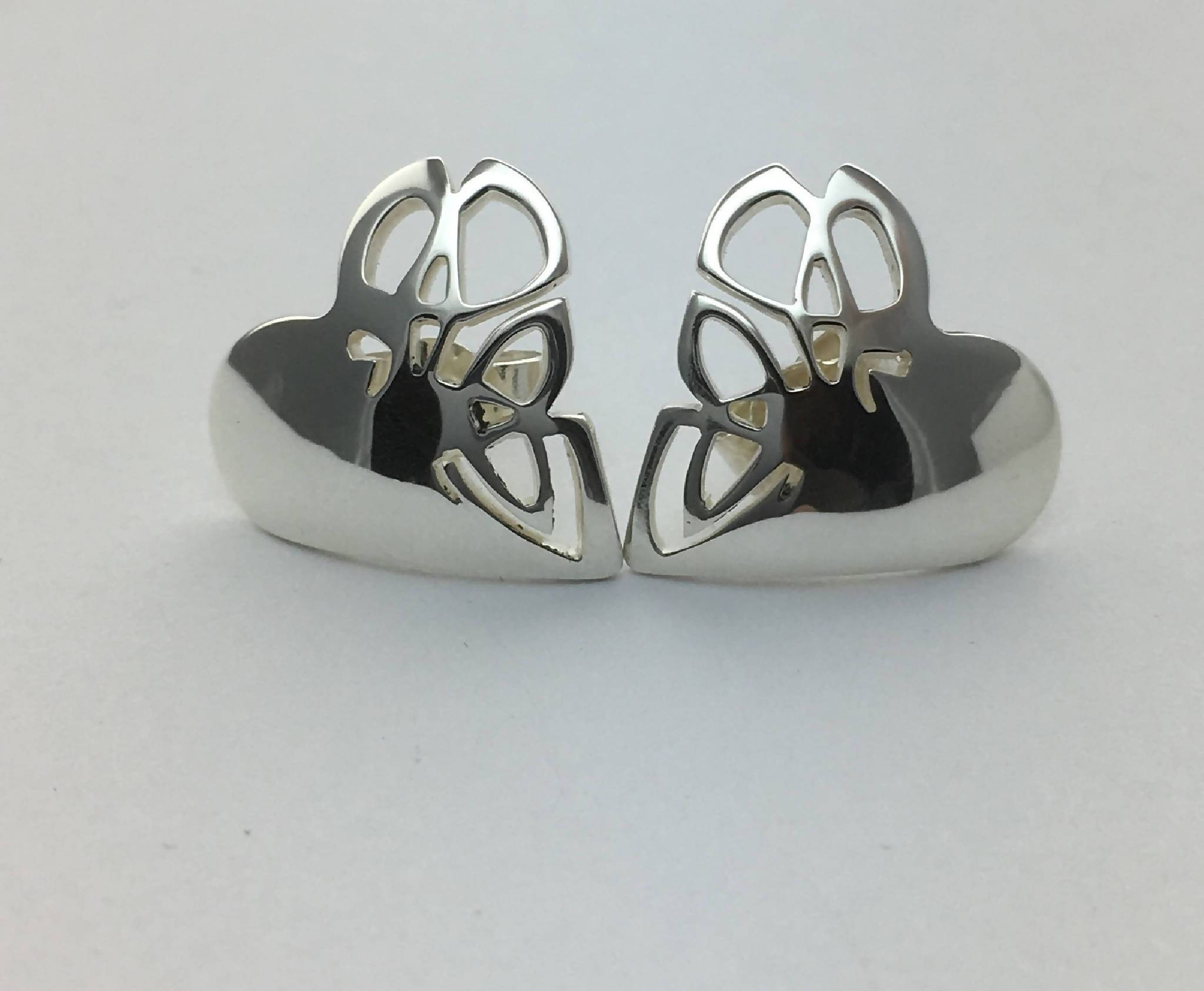 Heart shape stud earrings with Celtic knot design