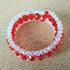 3 strand silver toned Memory wire child's bangle with red & clear beads - 4cm diameter