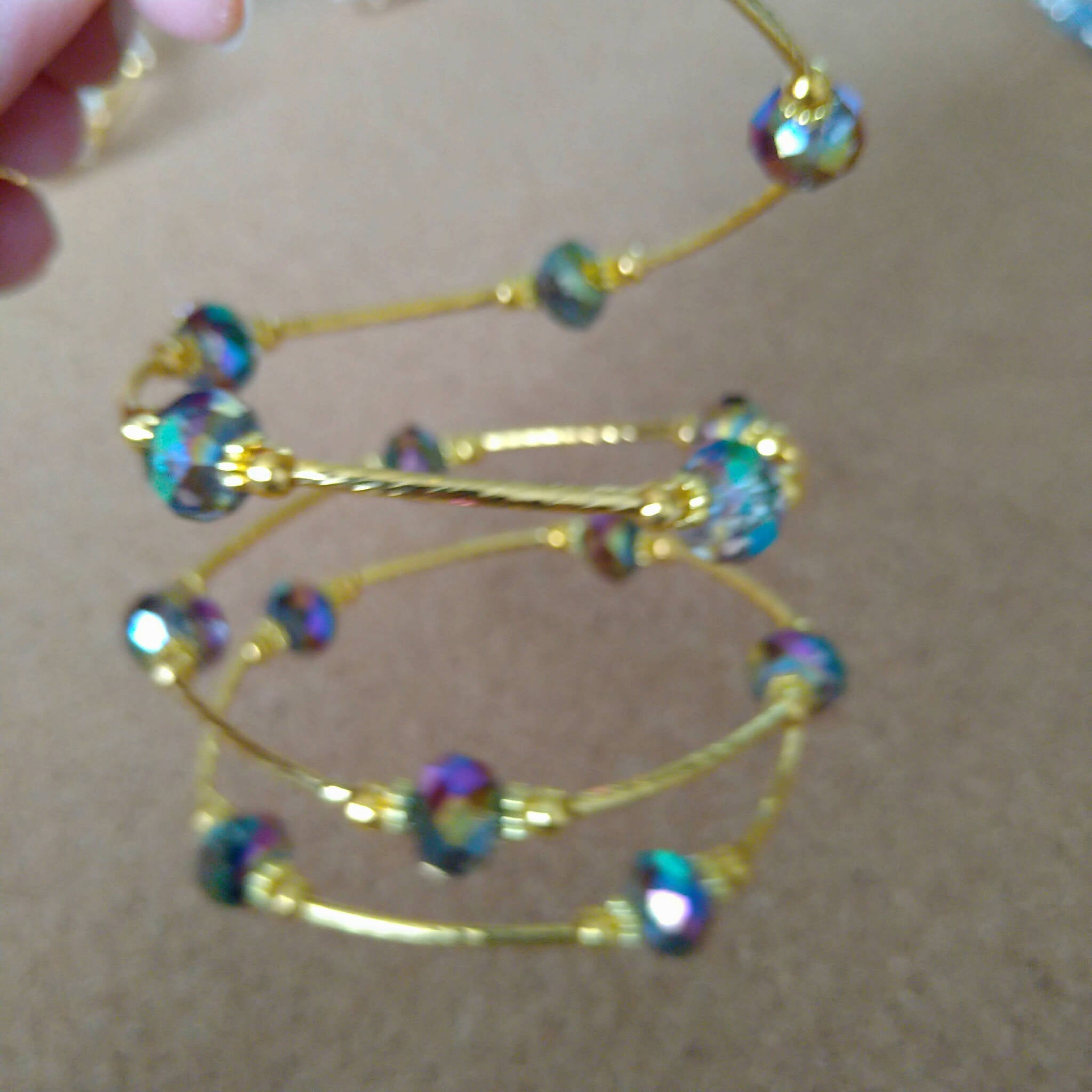3 strand gold toned memory wire bangle with blue/purple AB finish beads, 6cm diameter