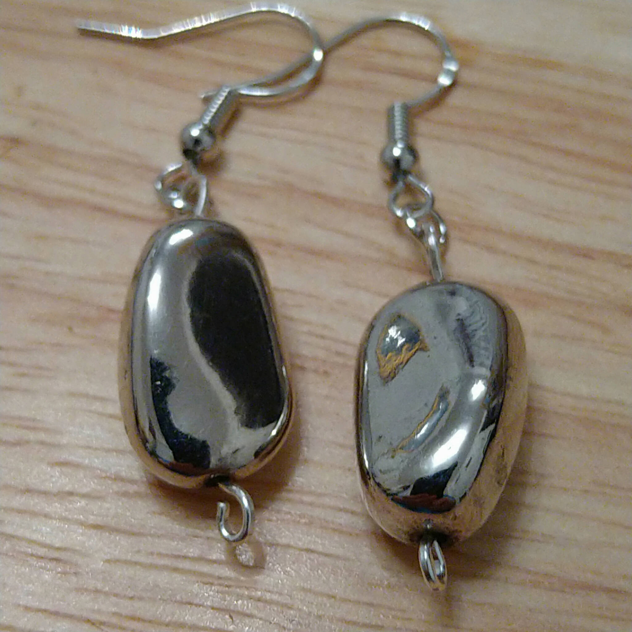 Handmade earrings with silver coloured "nugget" bead