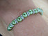 Green & Silver coloured bracelet, handmade using recycled green pearlescent beads & Silver crystal rondelles. 20cm length
