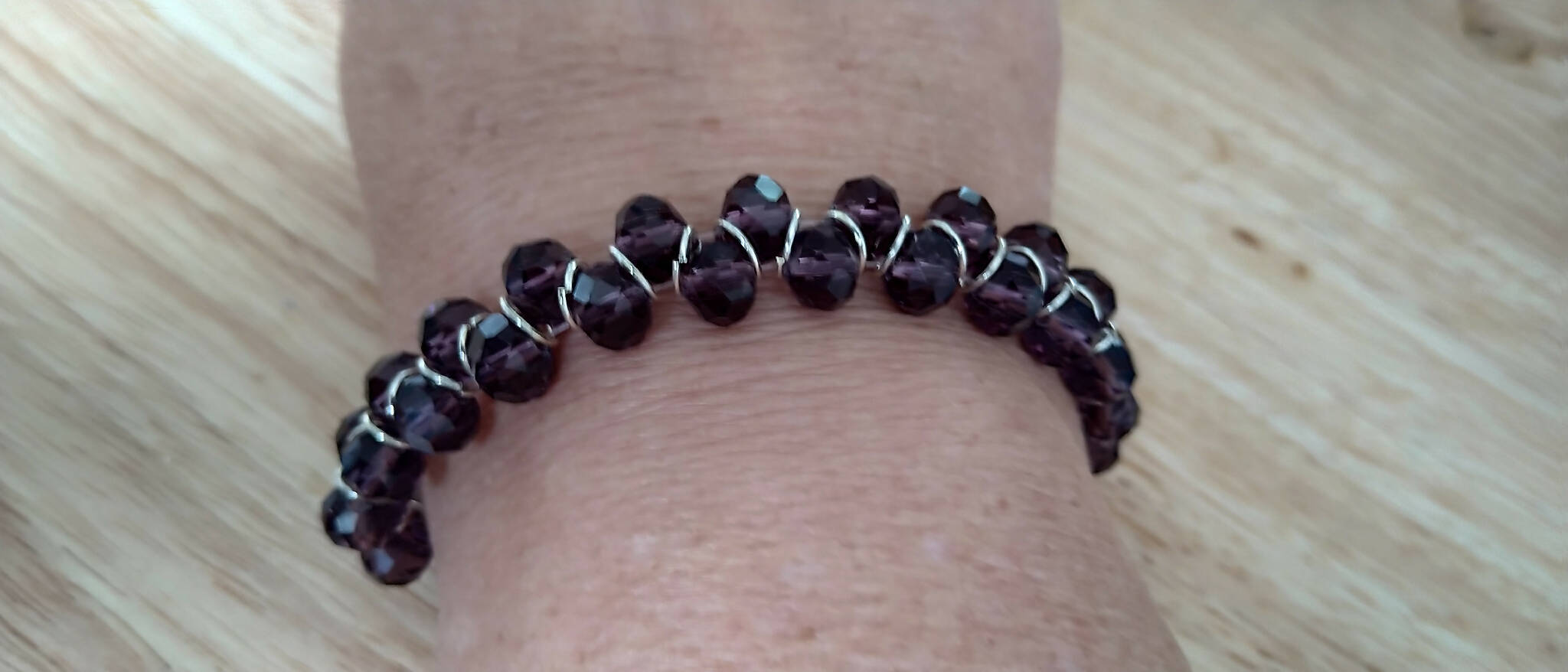 Purple coloured bracelet, handmade using glass faceted beads in a zigzag pattern. 18cm length