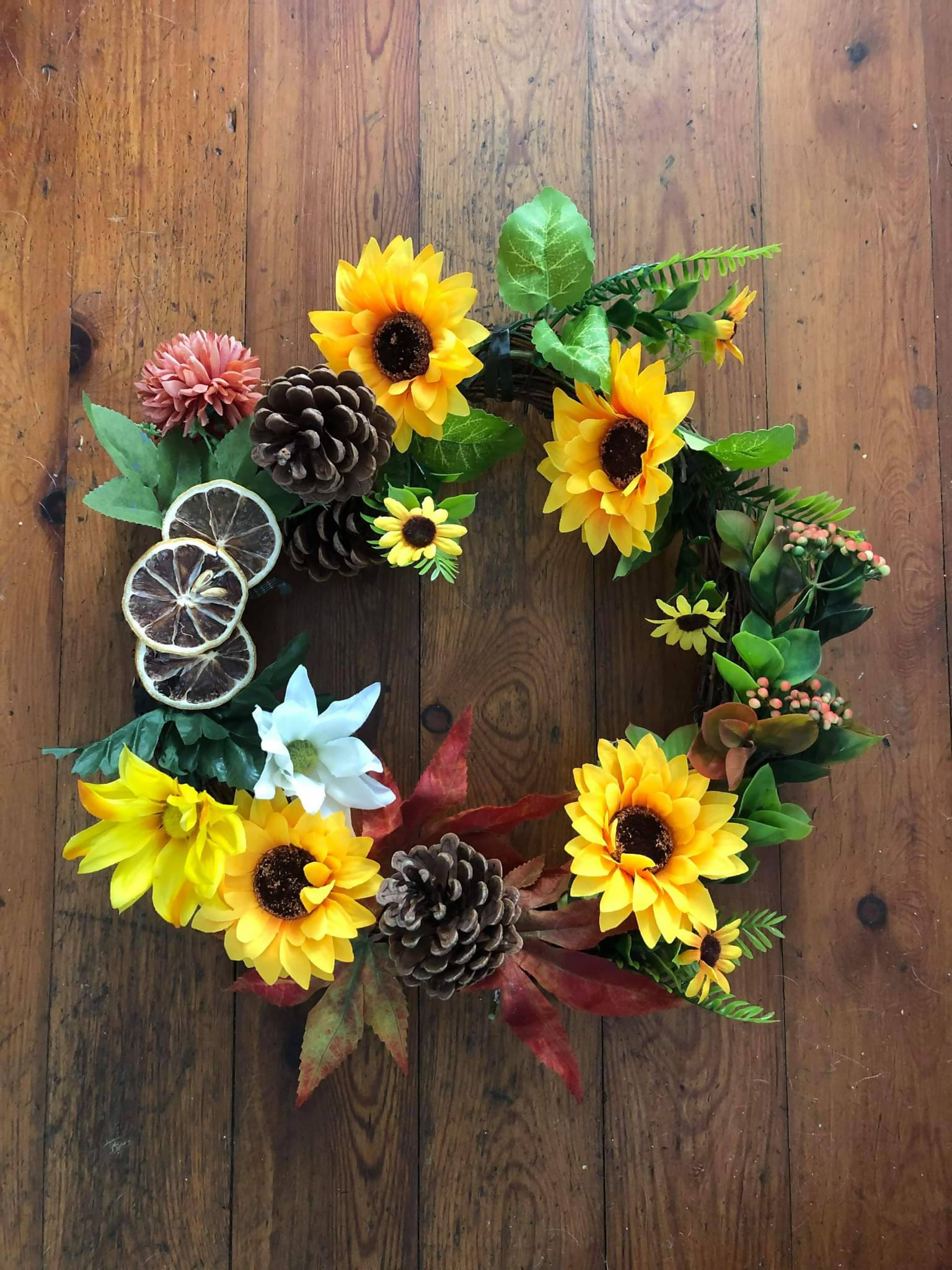 Autumnal wreath with sunflowers