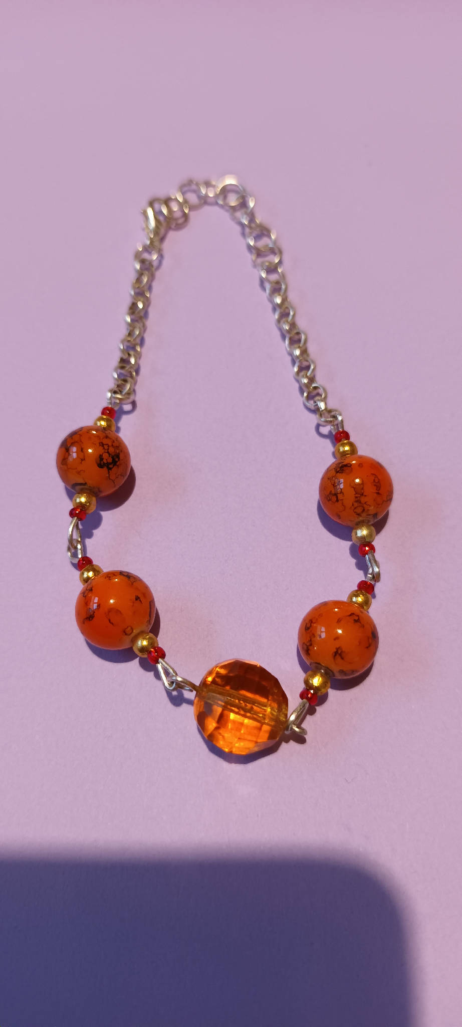 Orange bead and chain bracelet