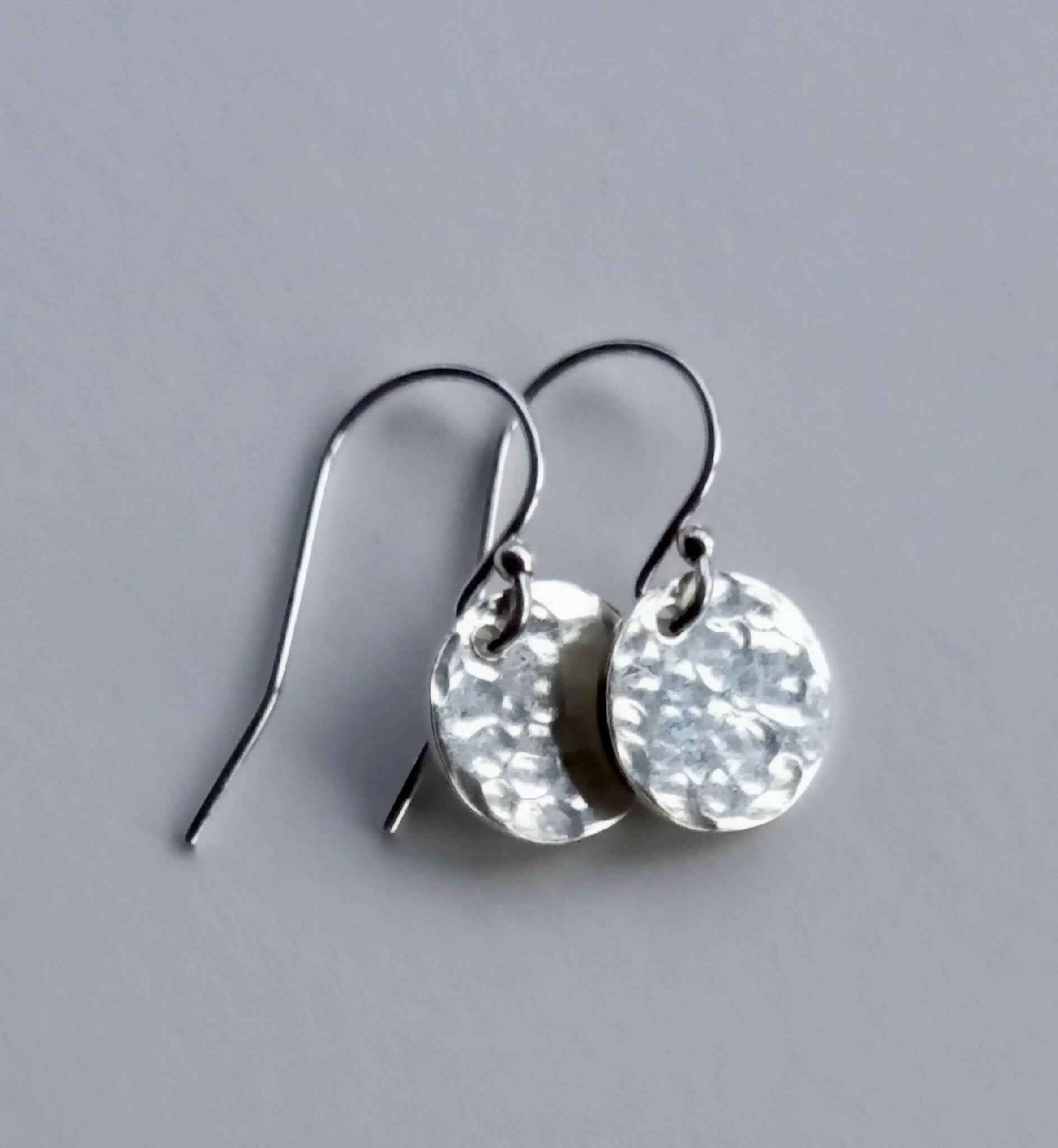 Hammered silver earrings.