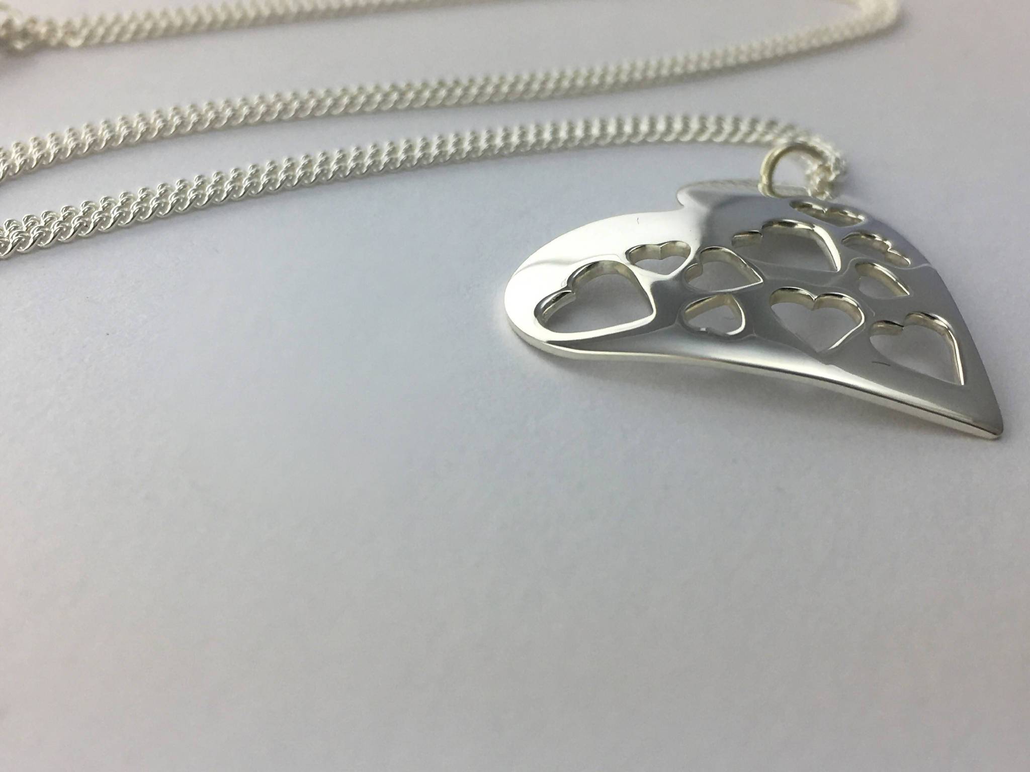 Heart filled with hearts pendant