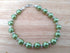Green & Silver coloured bracelet, handmade using recycled green pearlescent beads & Silver coloured spacers. 21cm length