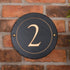 Round rustic slate house number